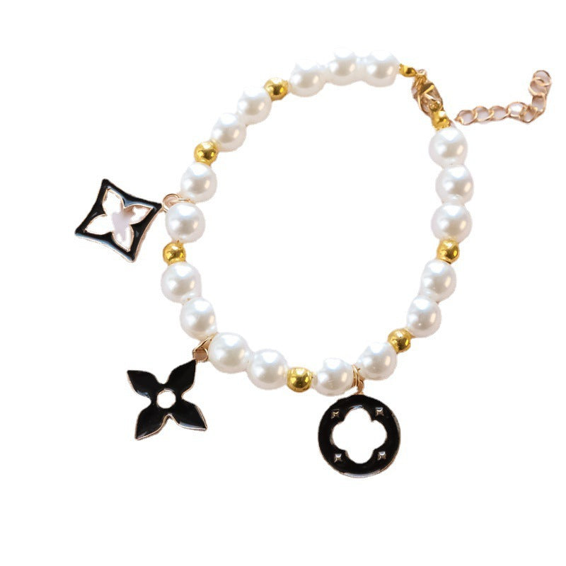 Cross-border hot-selling pet collar kitten dog bell pearl necklace lady jewelry four-leaf clover pet collar
