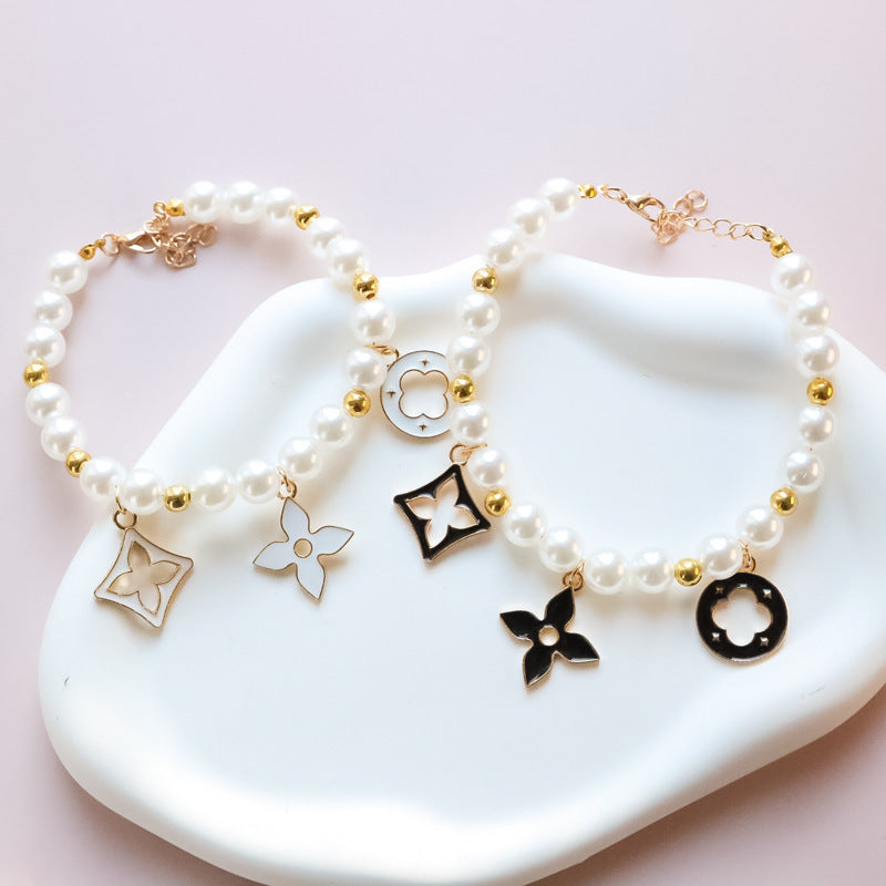 Cross-border hot-selling pet collar kitten dog bell pearl necklace lady jewelry four-leaf clover pet collar