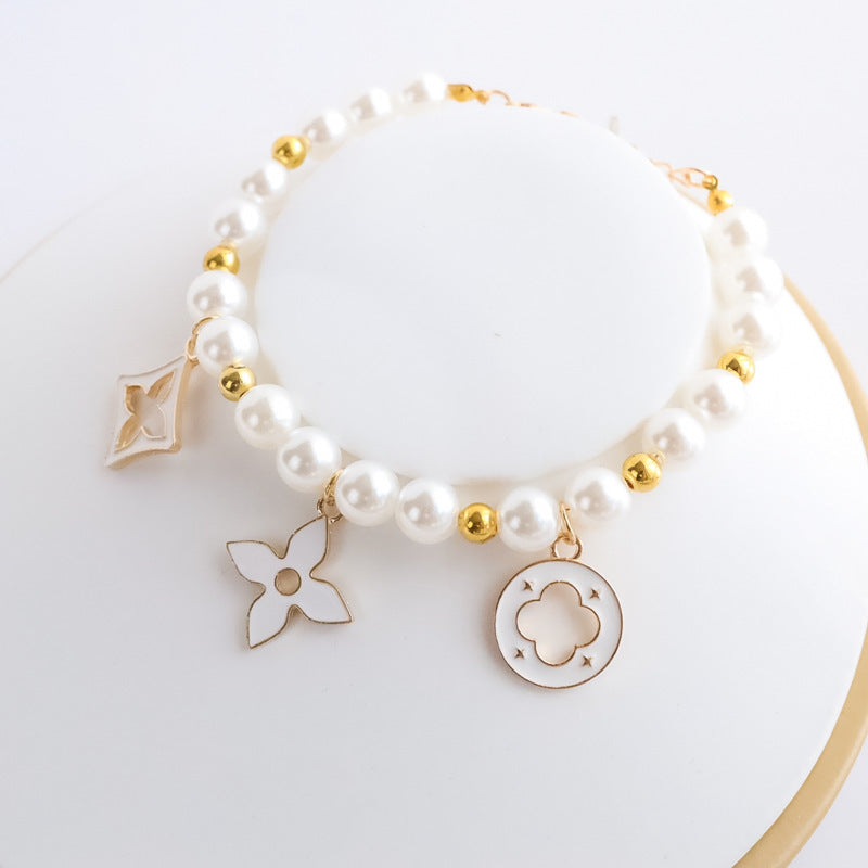 Cross-border hot-selling pet collar kitten dog bell pearl necklace lady jewelry four-leaf clover pet collar