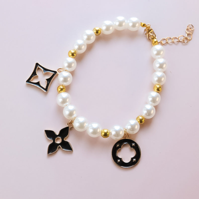 Cross-border hot-selling pet collar kitten dog bell pearl necklace lady jewelry four-leaf clover pet collar